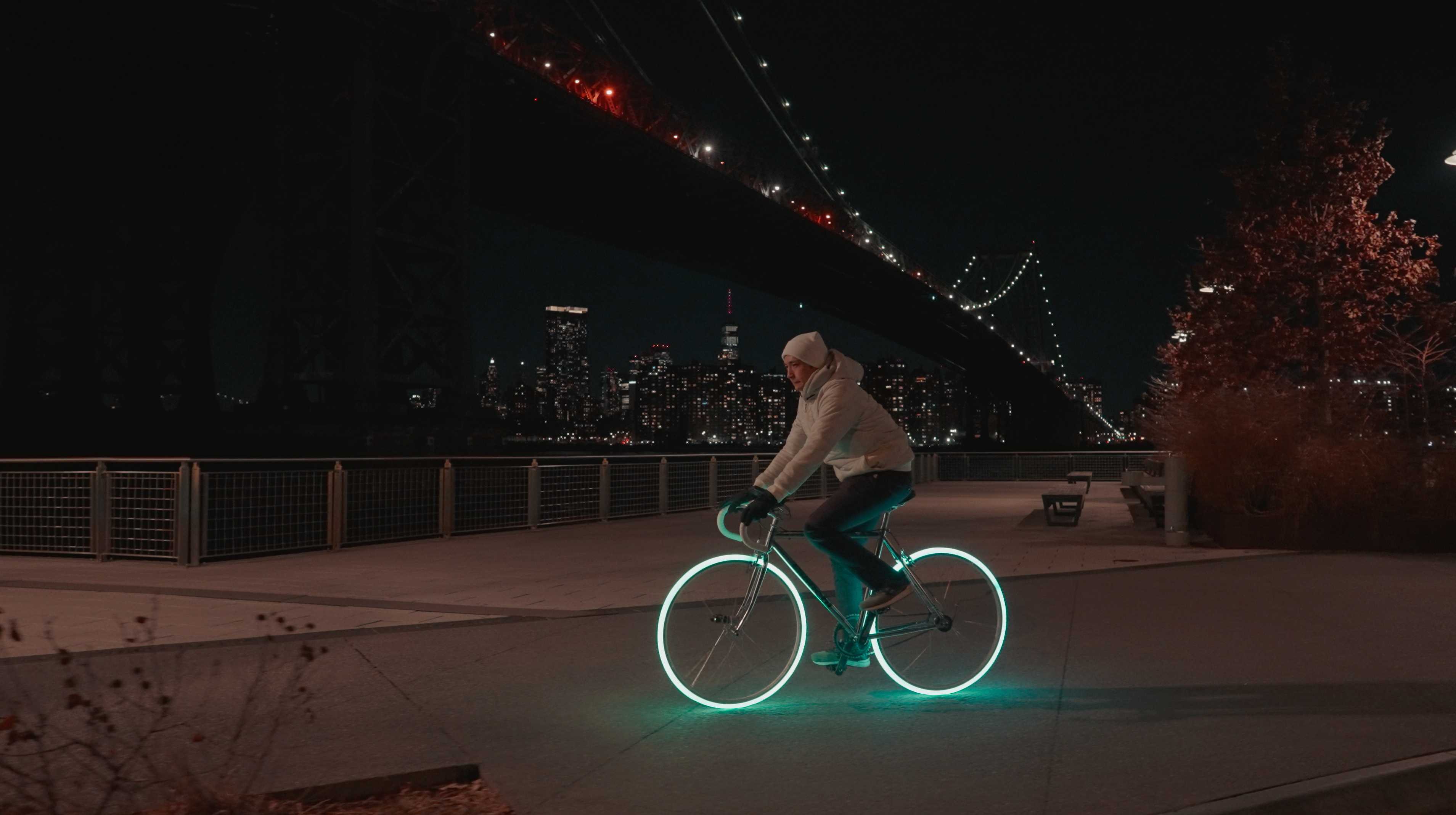 Lumona tire glowing blue on a bicycle at night