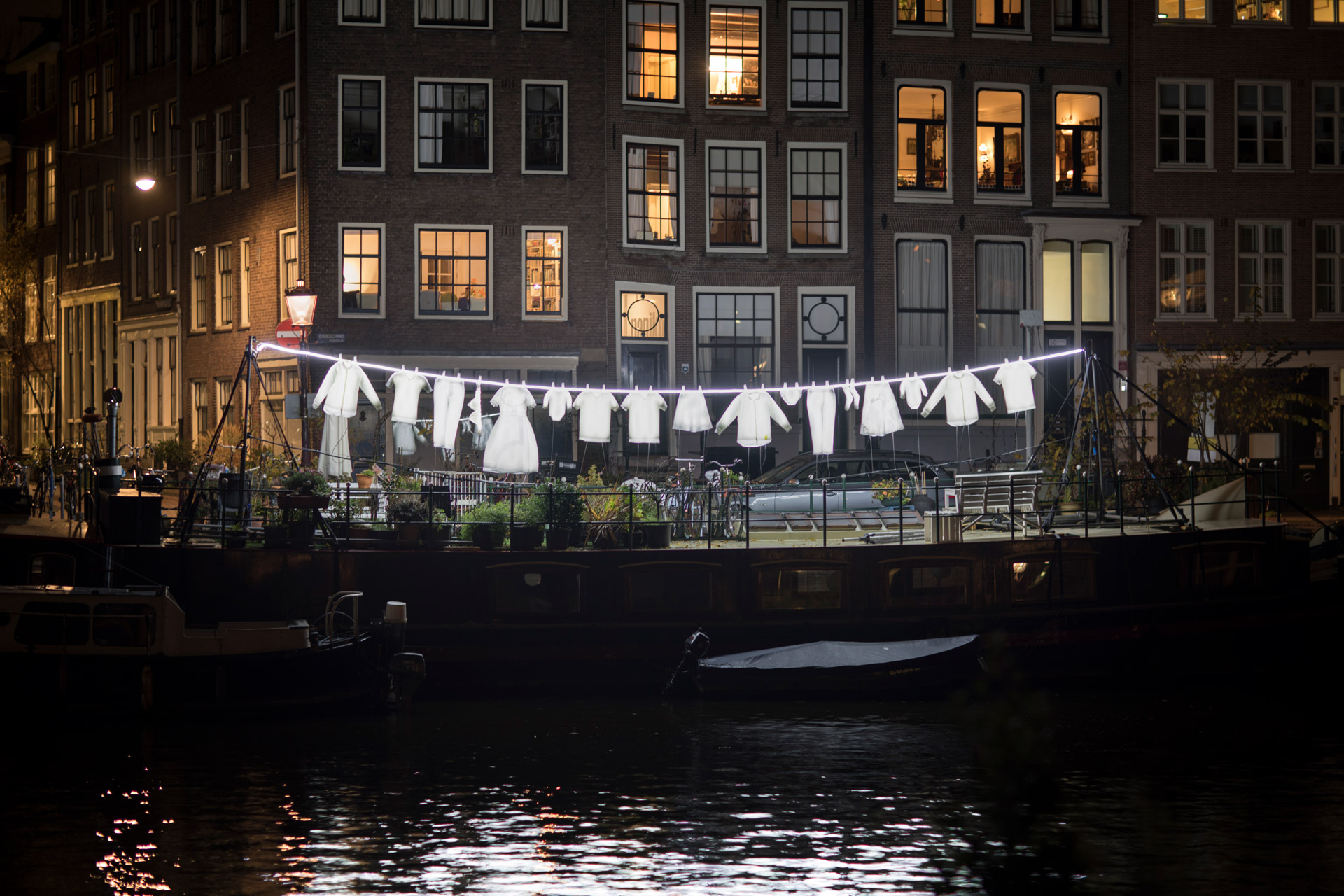 Neighborhood installed over the Oudeschans canal in Amsterdam at night